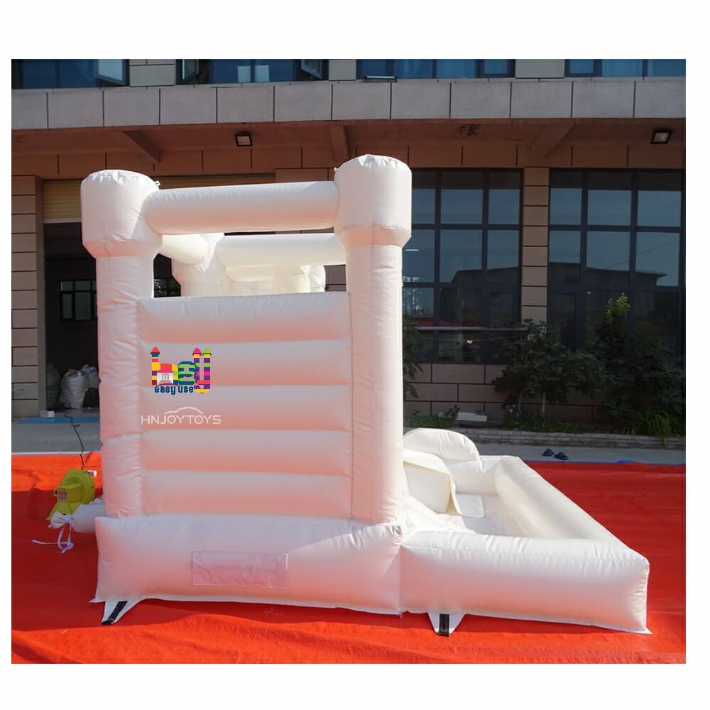 white bouncy castle with balloons