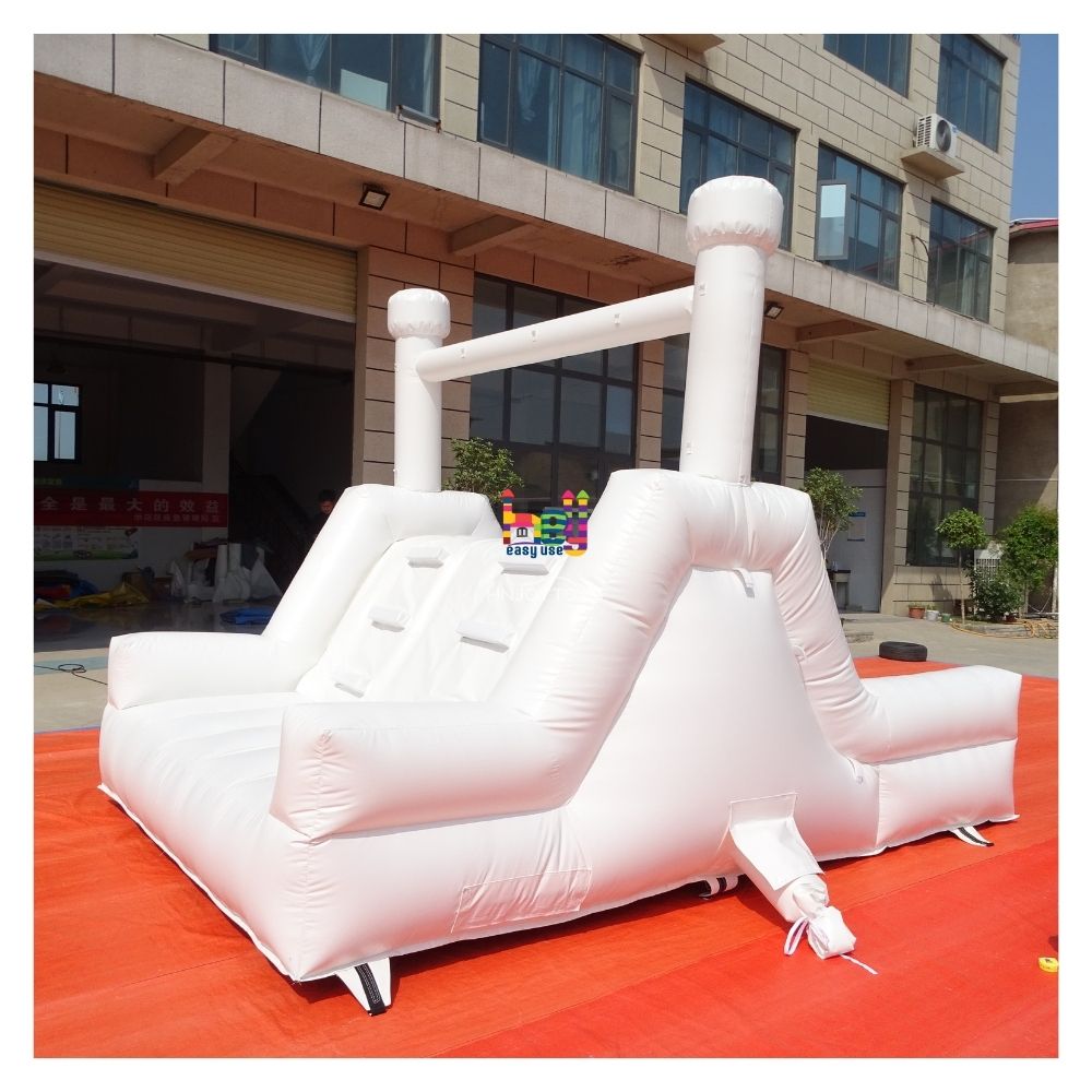 white inflatable wedding bounce house with slide