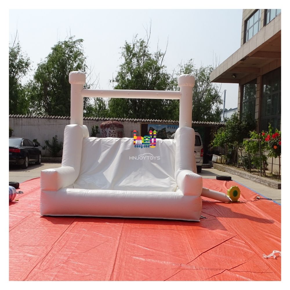 white inflatable wedding bounce house with slide