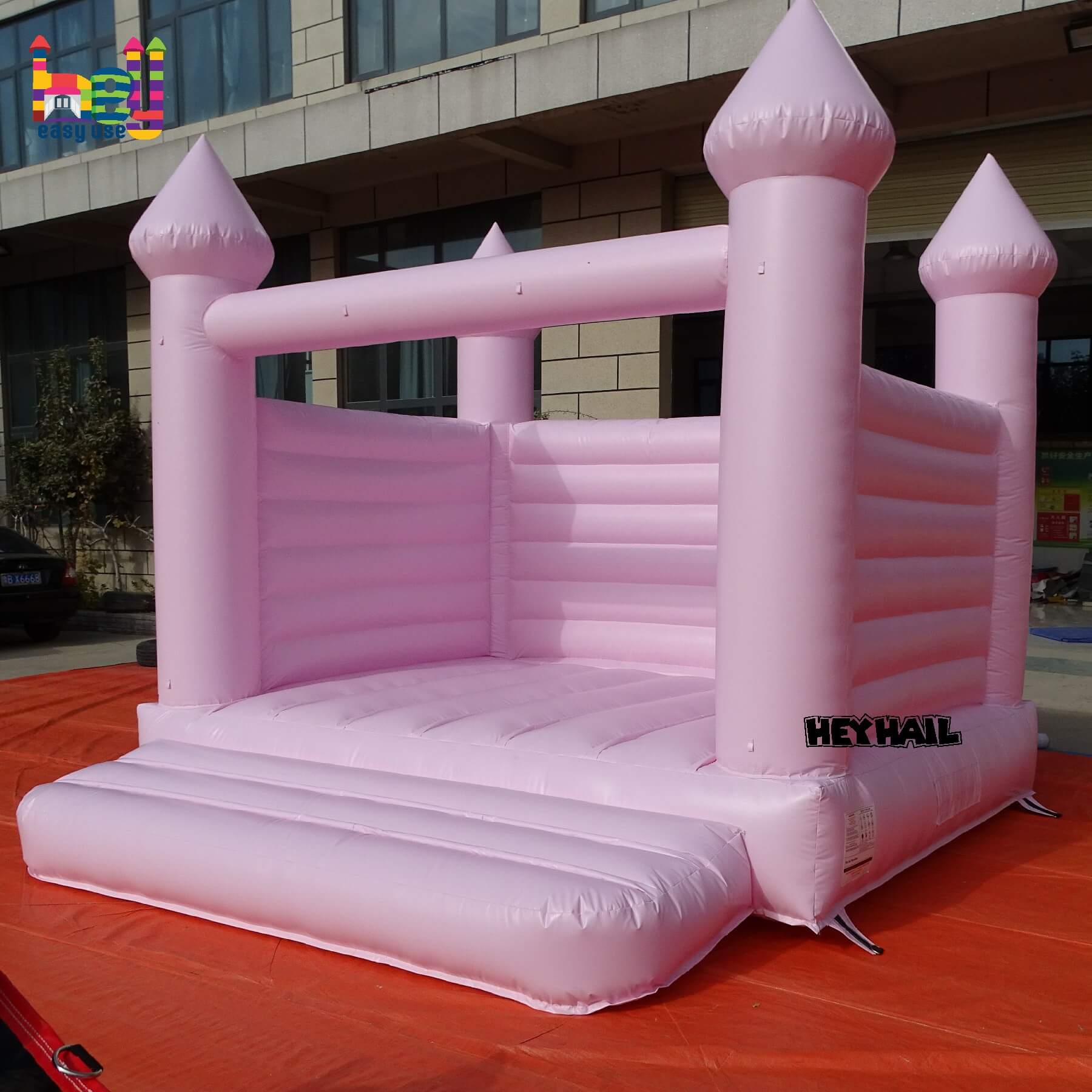 light pastel pink inflatable castle 