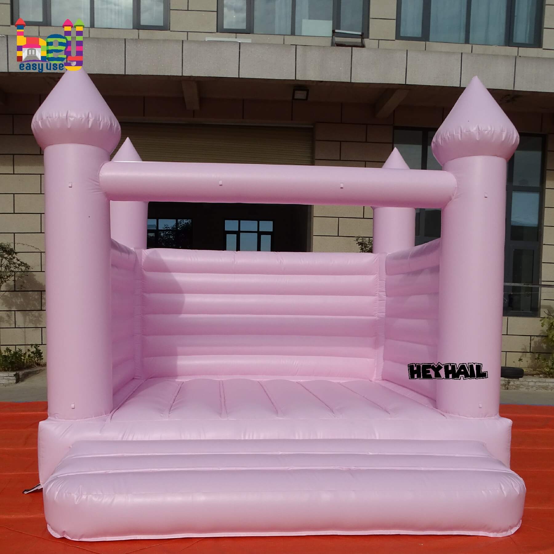 light pastel pink inflatable castle 