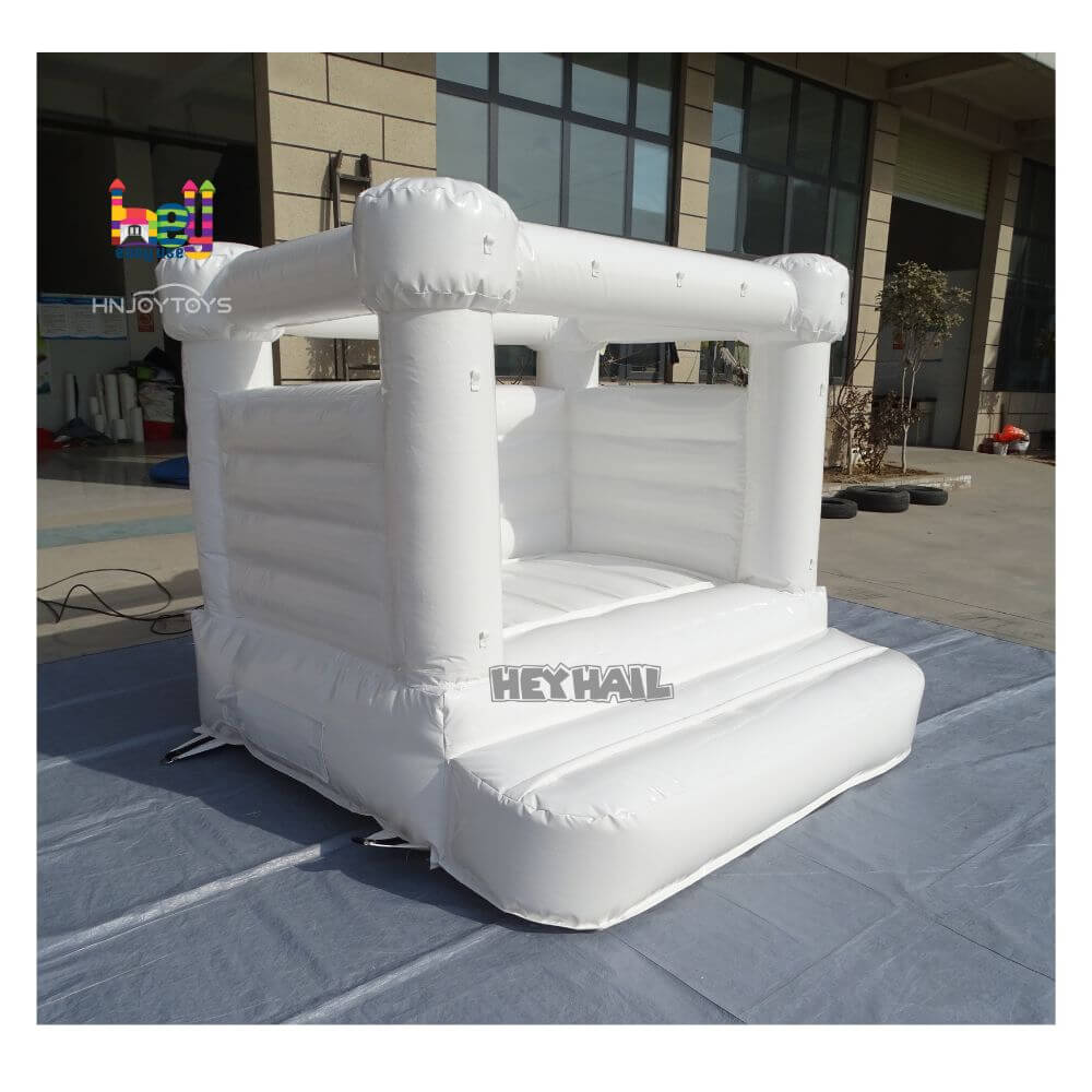 white inflatable bounce house wedding theme