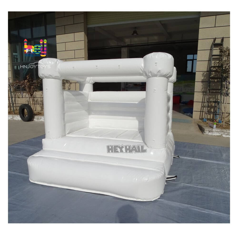 white inflatable bounce house wedding theme